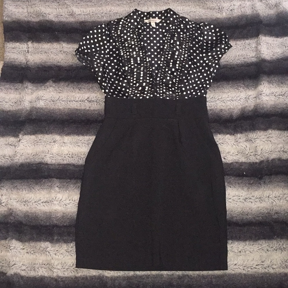 Black and white polka dotted business attire